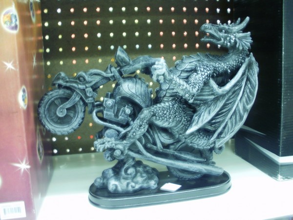 Dragon riding a motorcycle